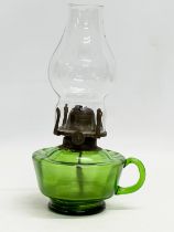 A Victorian Bristol Green oil lamp/finger lamp. 14x26cm