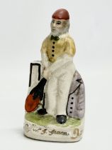 A mid 19th century Staffordshire W. G. Grace ‘Cricket Player’ figure. 14cm