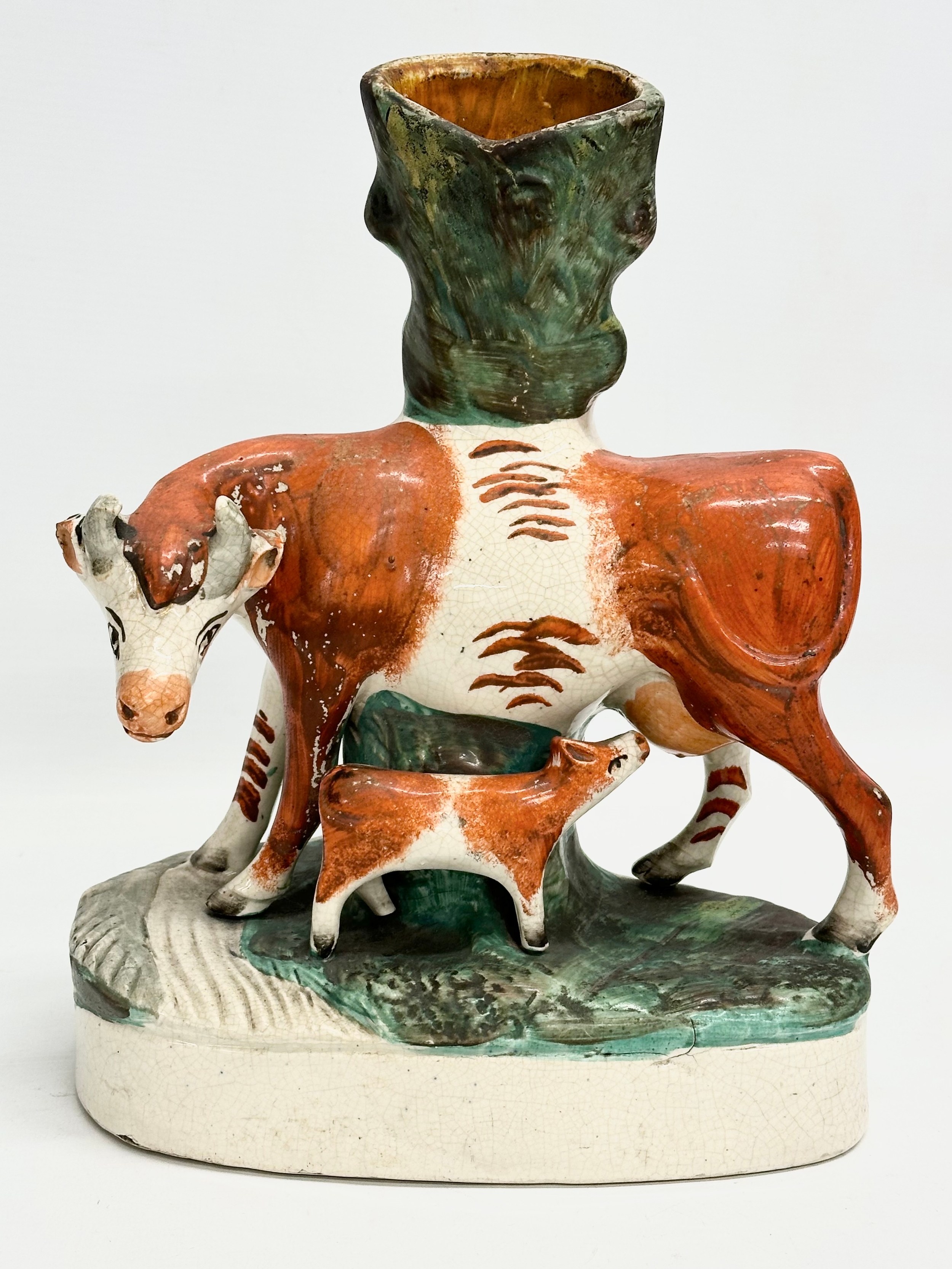 A pair of mid/late 19th century Staffordshire Cow spill vases. 22x27.5cm - Image 2 of 7