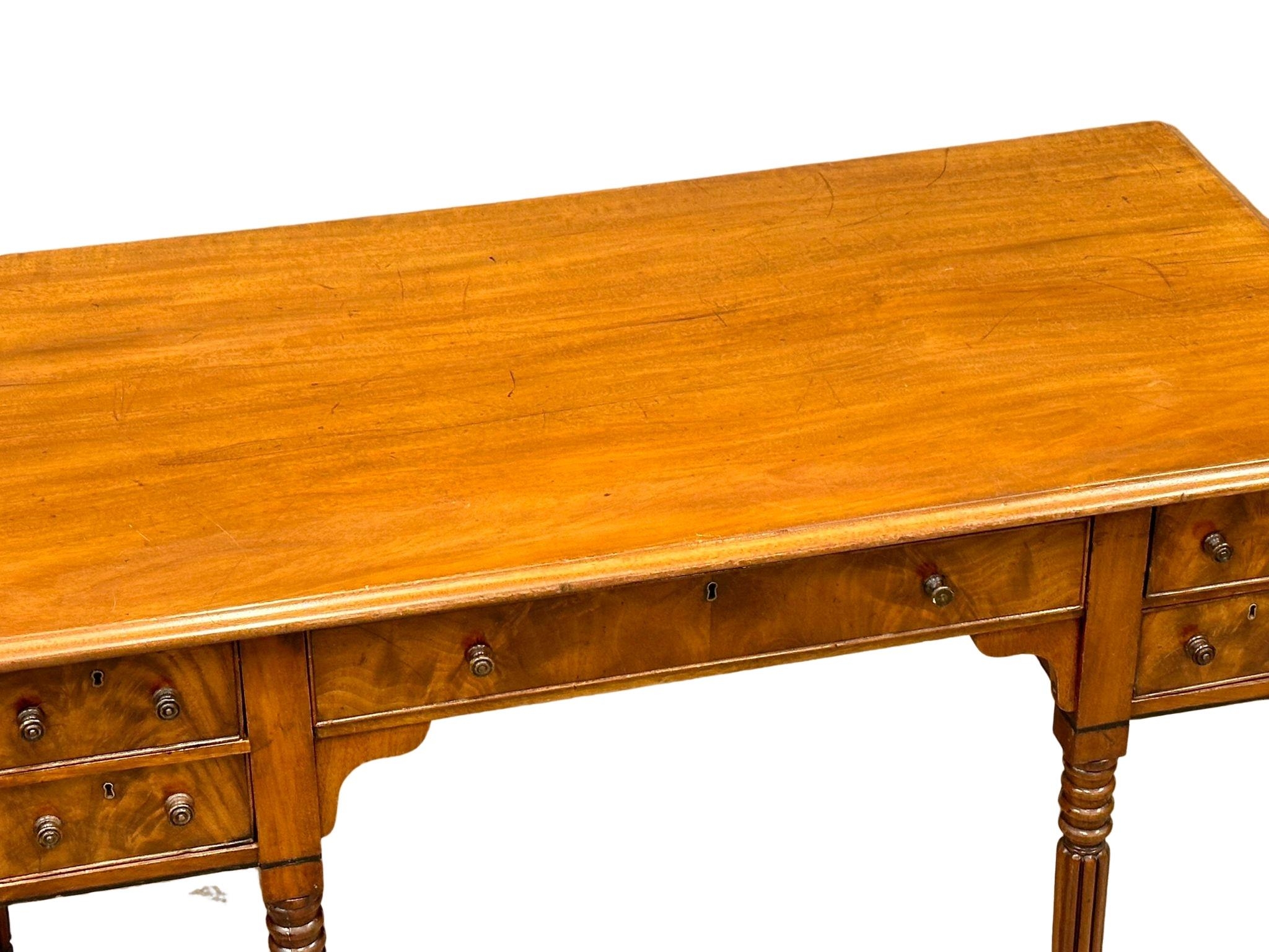 A late George IV mahogany side table/desk on reeded legs. 126cm x 61cm x 80cm - Image 9 of 9