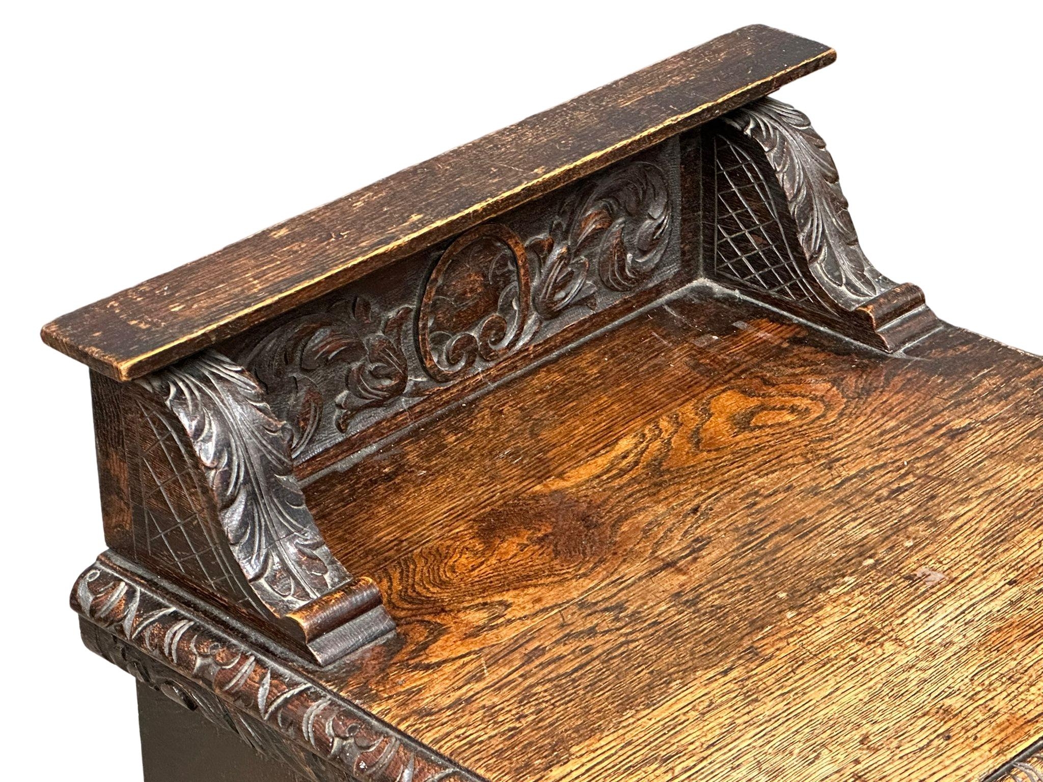 A Victorian carved oak purdonium/coal box. Circa 1870. 47cm x 41cm x 67cm - Image 4 of 7