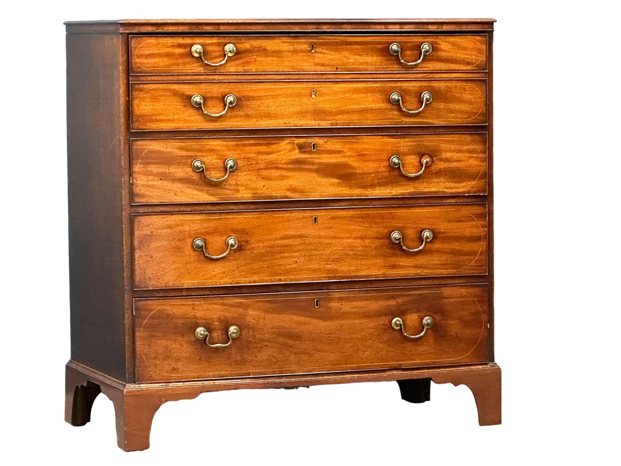 A good quality George III inlaid mahogany secretaire chest of drawers with original brass drop
