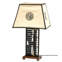 A large Chinese brass bound abacus table lamp. 44x31x74cm