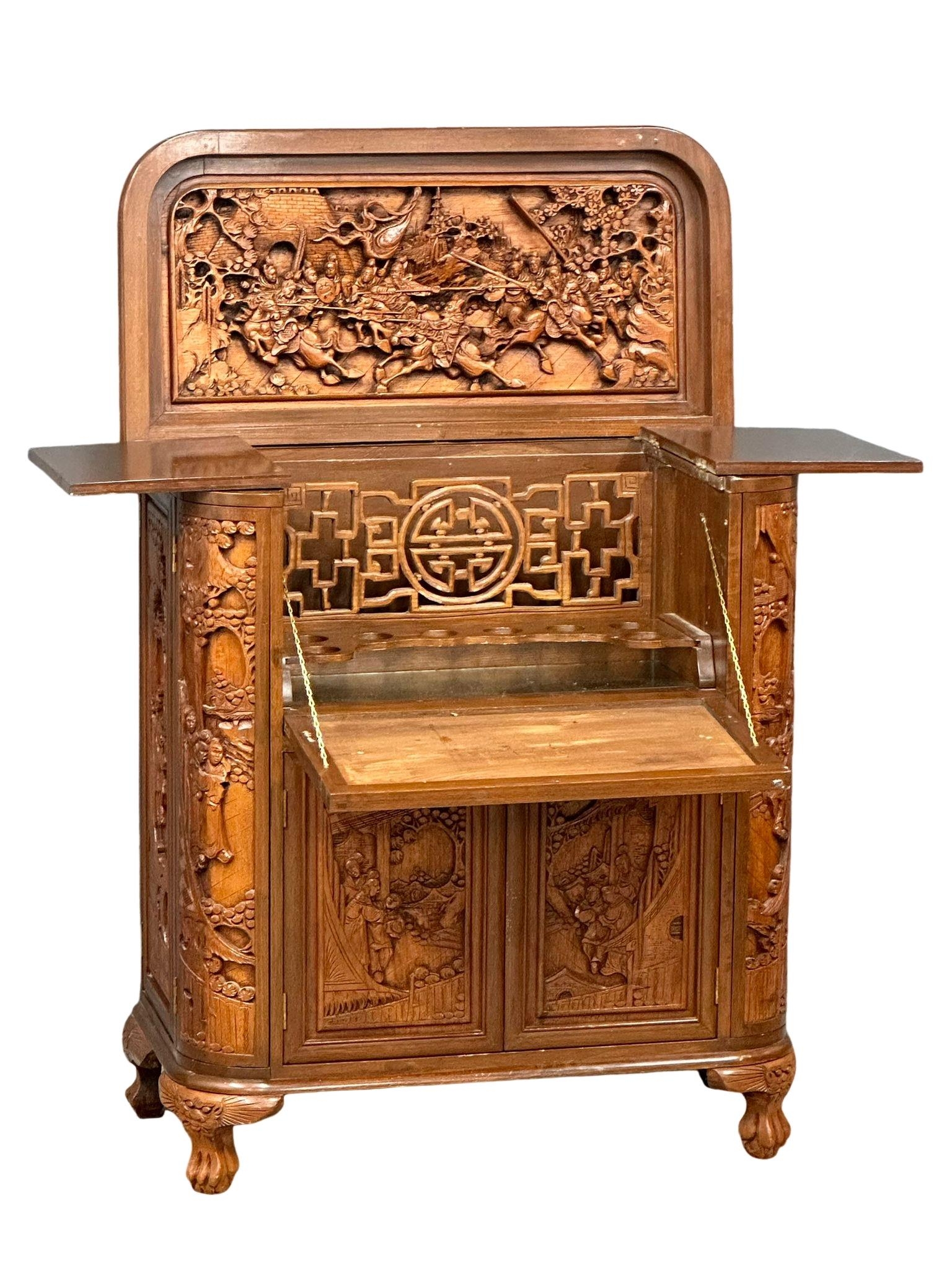 A vintage Chinese style carved teak folding cocktail bar. Closed 91x48x107cm
