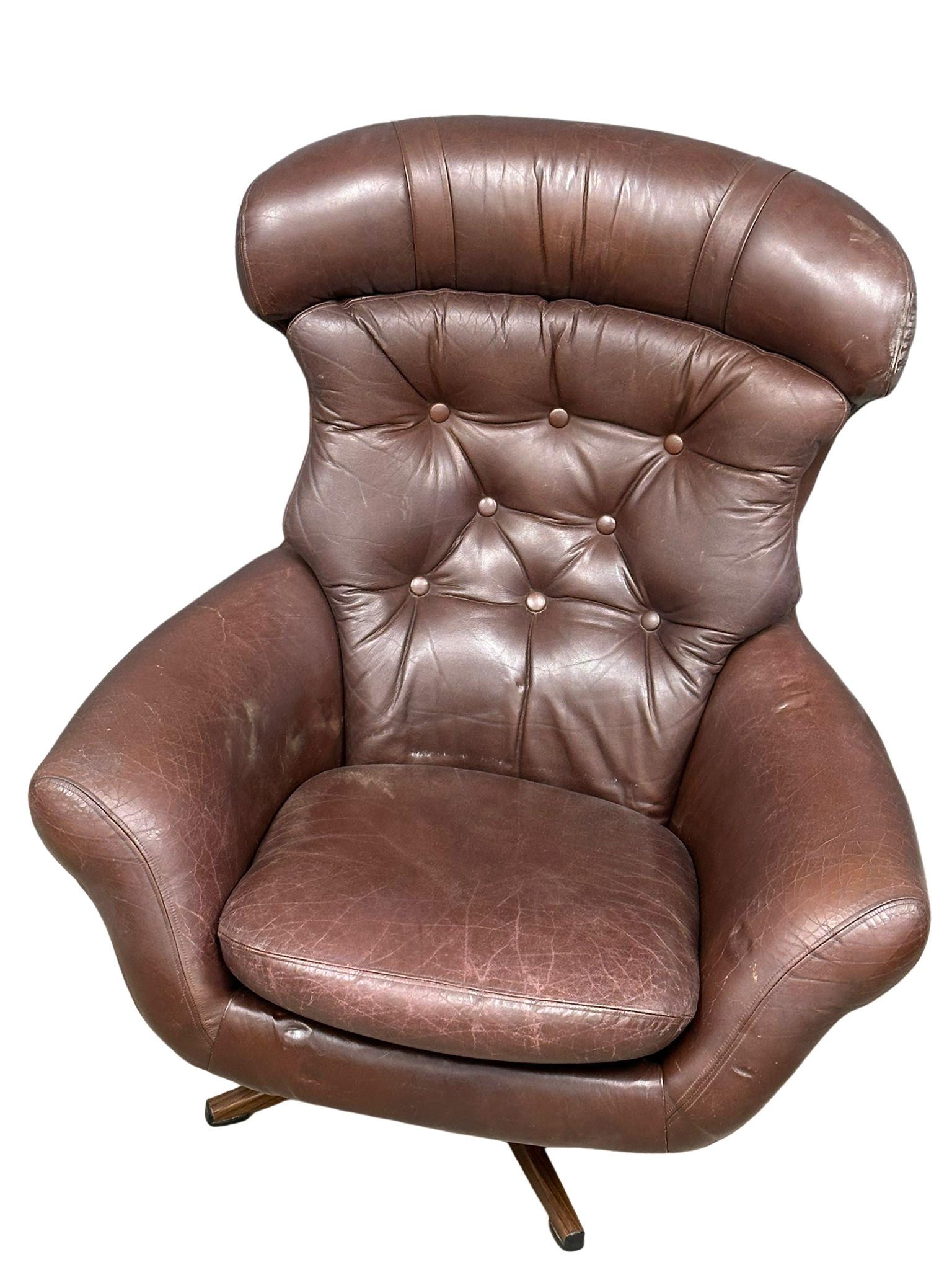 A Swedish Mid Century Gungan Slatte leather swivel chair on faux rosewood base.1 - Image 5 of 5