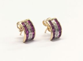 A pair of 9ct gold, ruby and diamond earrings. 1.47g