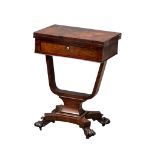 A good quality late William IV rosewood turnover games table on carved lion paw feet, circa 1835-40