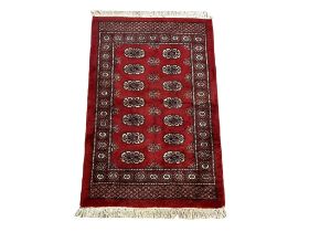 A vintage hand knotted Turkoman Afghan rug. 100x166cm