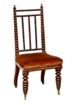 A Victorian walnut Bobbin Turn side chair on brass cup casters, circa 1850-70s.