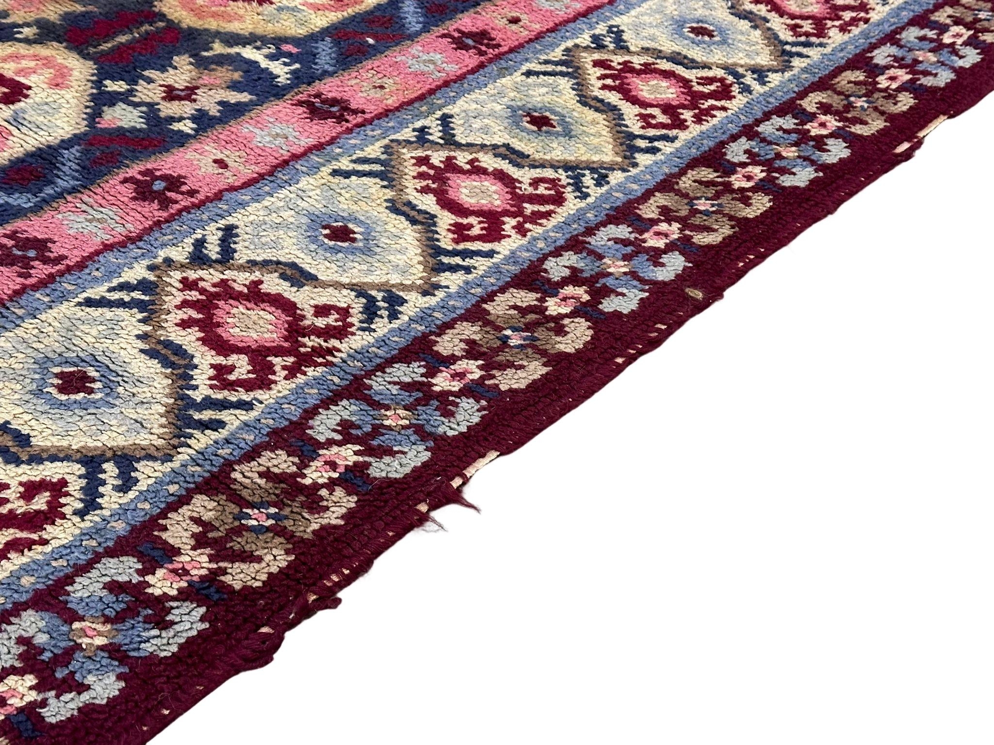 A large vintage Middle Eastern style wool rug. 229x123cm - Image 3 of 5