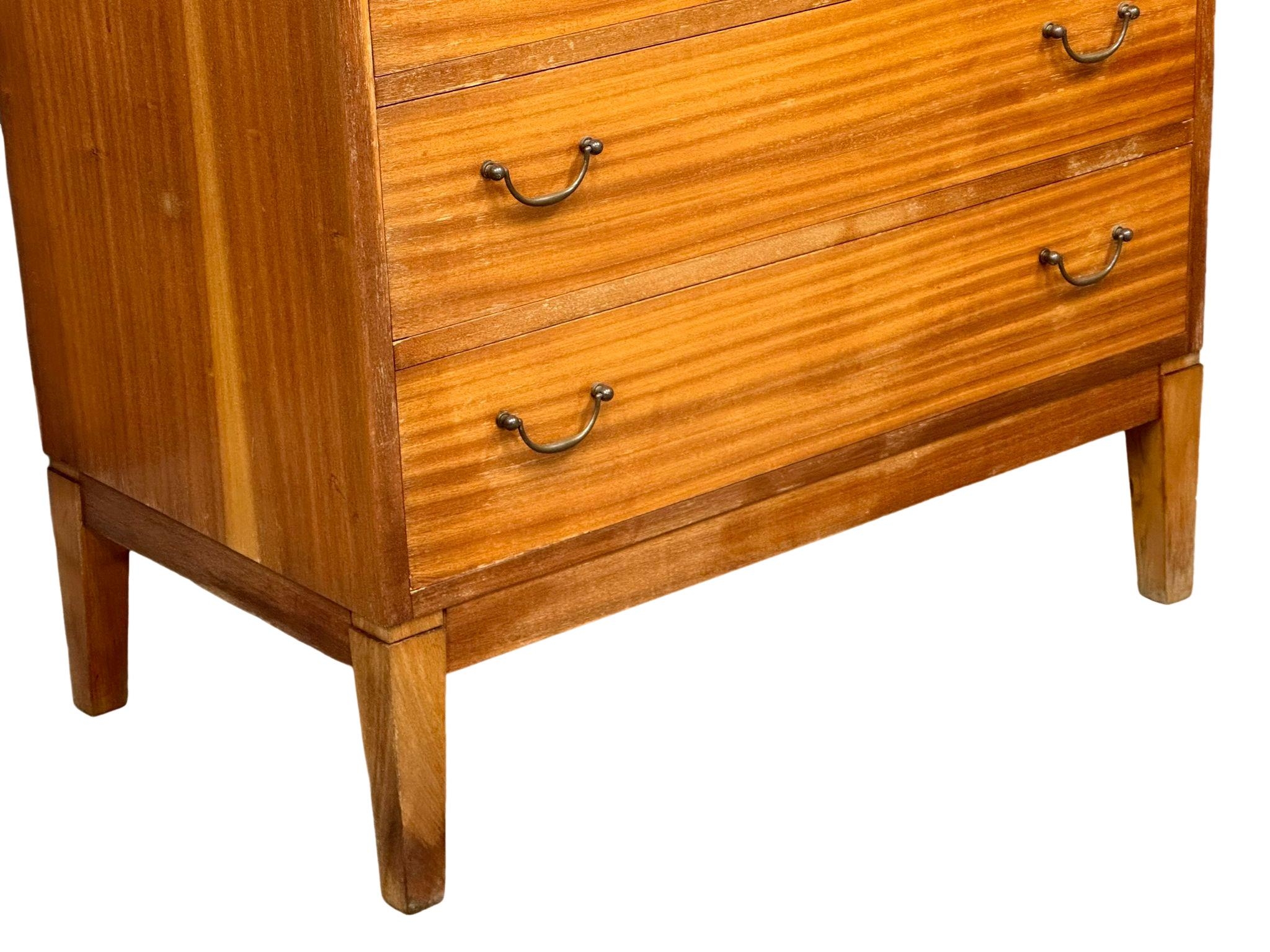 A large Danish Mid Century tola wood tallboy chest of drawers. 75.5x43.5x132.5cm(4) - Image 6 of 8