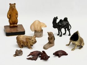 A collection of 20th century stone and wooden animals.