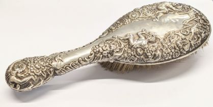 A late 19th century ornate silver vanity brush. Chester, 1897. 241.8g. 25x9.5cm