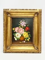 A Still Life oil painting on canvas by R. Rossini. In gilt frame. 22.5x28.5cm. Frame 40x46.5cm