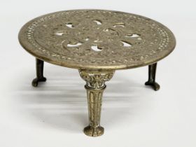 Christopher Dresser. A late 19th century Kenrick brass trivet stand designed by Christopher Dresser.