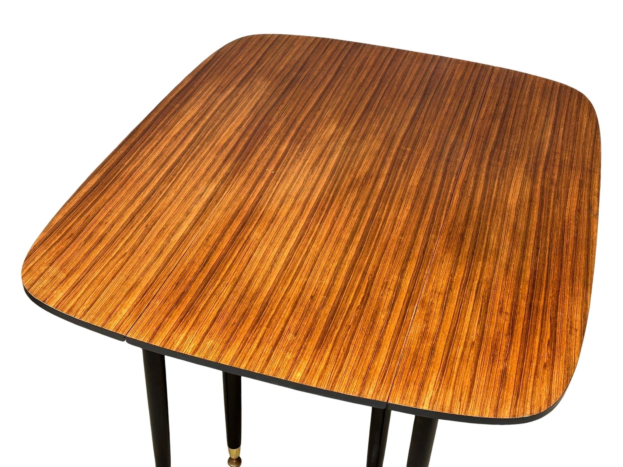 A large G-Plan "Librenza" tola wood drop-leaf dining table, circa 1950-60. 133cm x 107cm x 72cm - Image 3 of 4