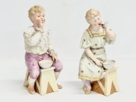 A pair of late 19th century Heubach bisque ‘Bubbles’ figures. Circa 1890. 23cm