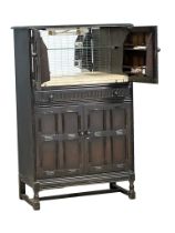 A vintage Priory style cocktail cabinet. 83x42x128