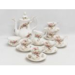 A 16 piece Royal Albert ‘Moss Rose’ coffee service.