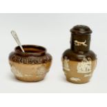 An early 20th century Royal Doulton Lambeth 2 piece condiment set. Salt and pepper shaker.