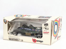 A Burago model car of Lotus MK4 1979, Martini-Tissot in box. Grand-Prix. 1/14 scale. Box measures