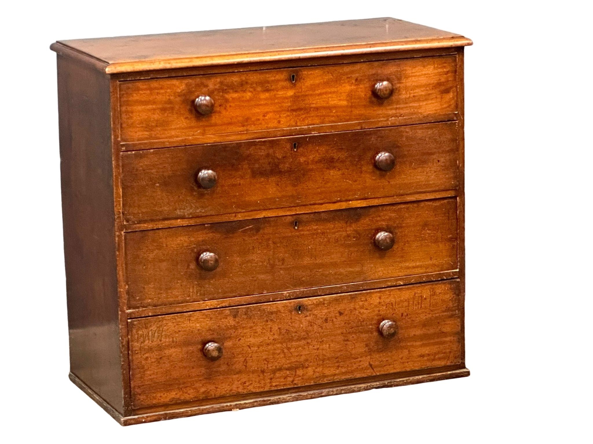 A large Victorian mahogany chest of drawers with bun handles, 109cm x 51cm x 101cm