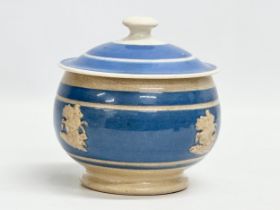 A mid 19th century English Mocha Ware sugar bowl with lid. 12x13cm