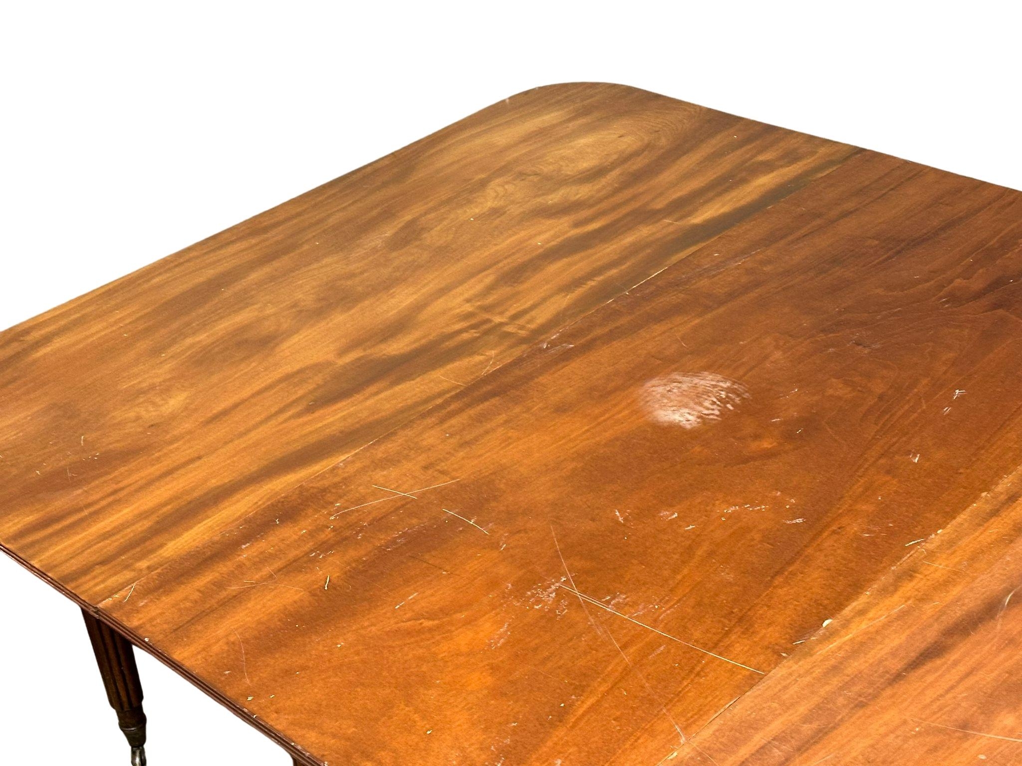 A large George IV mahogany Economy table/dining table with some later alterations. Circa 1820. 307. - Image 5 of 15