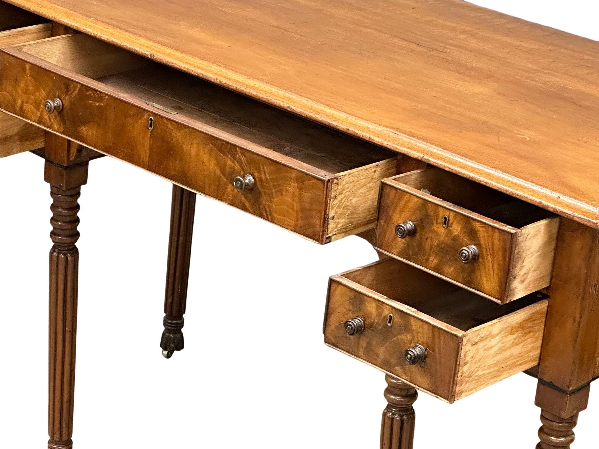 A late George IV mahogany side table/desk on reeded legs. 126cm x 61cm x 80cm - Image 7 of 9