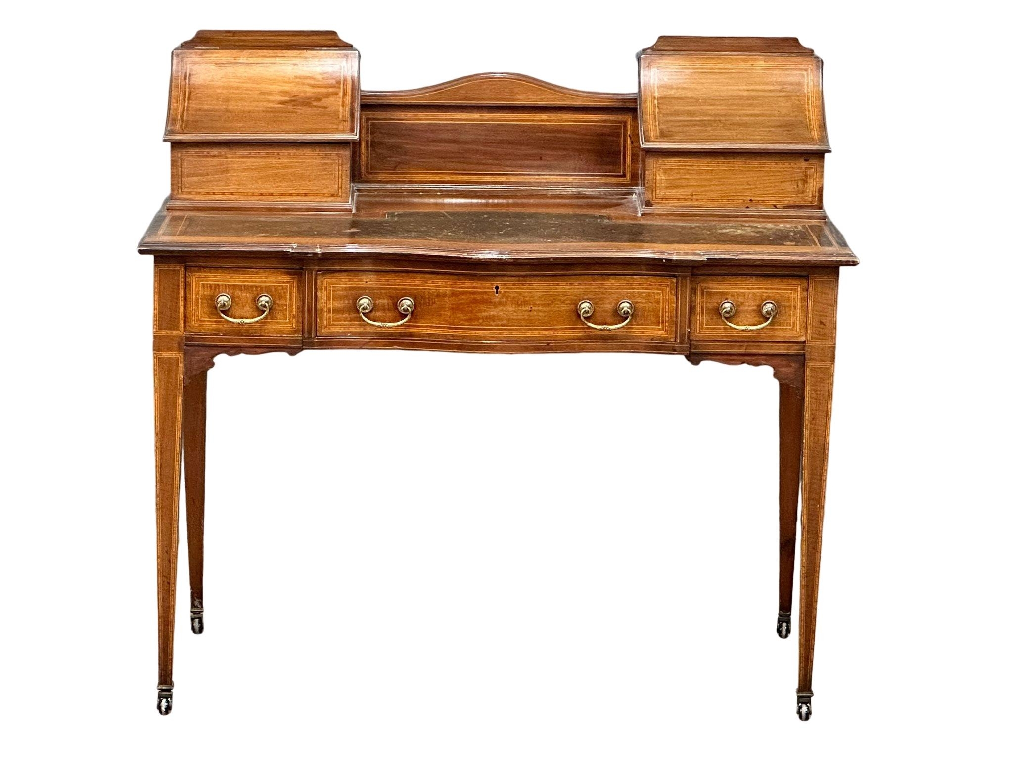An early 20th century Sheraton Revival inlaid mahogany writing desk with leather top and 3