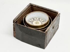 A 19th/early 20th century ships compass in box 16x16x10cm