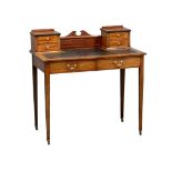 An early 20th century Sheraton Revival inlaid mahogany writing desk with leather top. Circa 1900-
