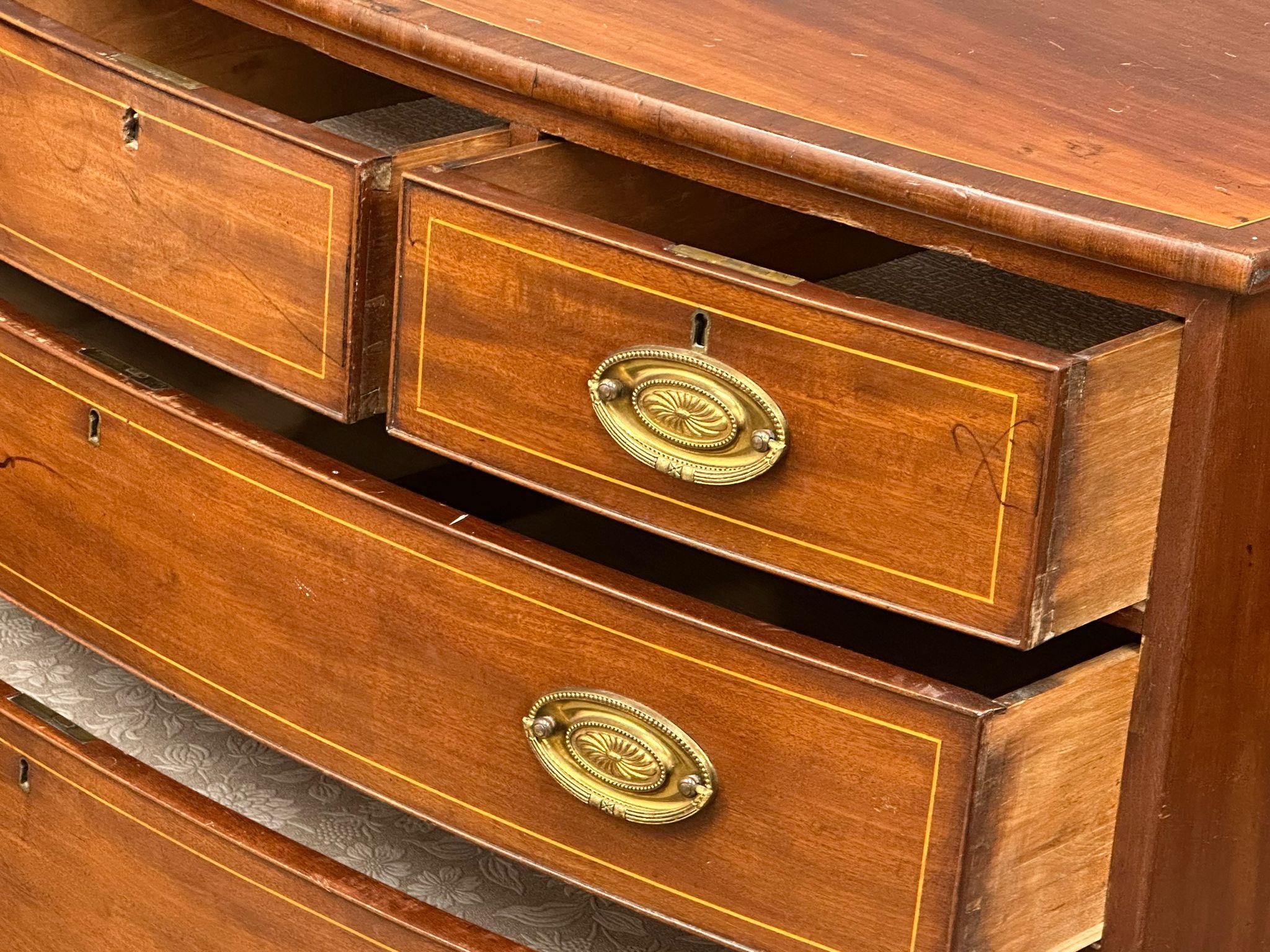 A George IV Inlaid mahogany box front chest of drawers with brass drop handles on splayed feet. - Image 5 of 8