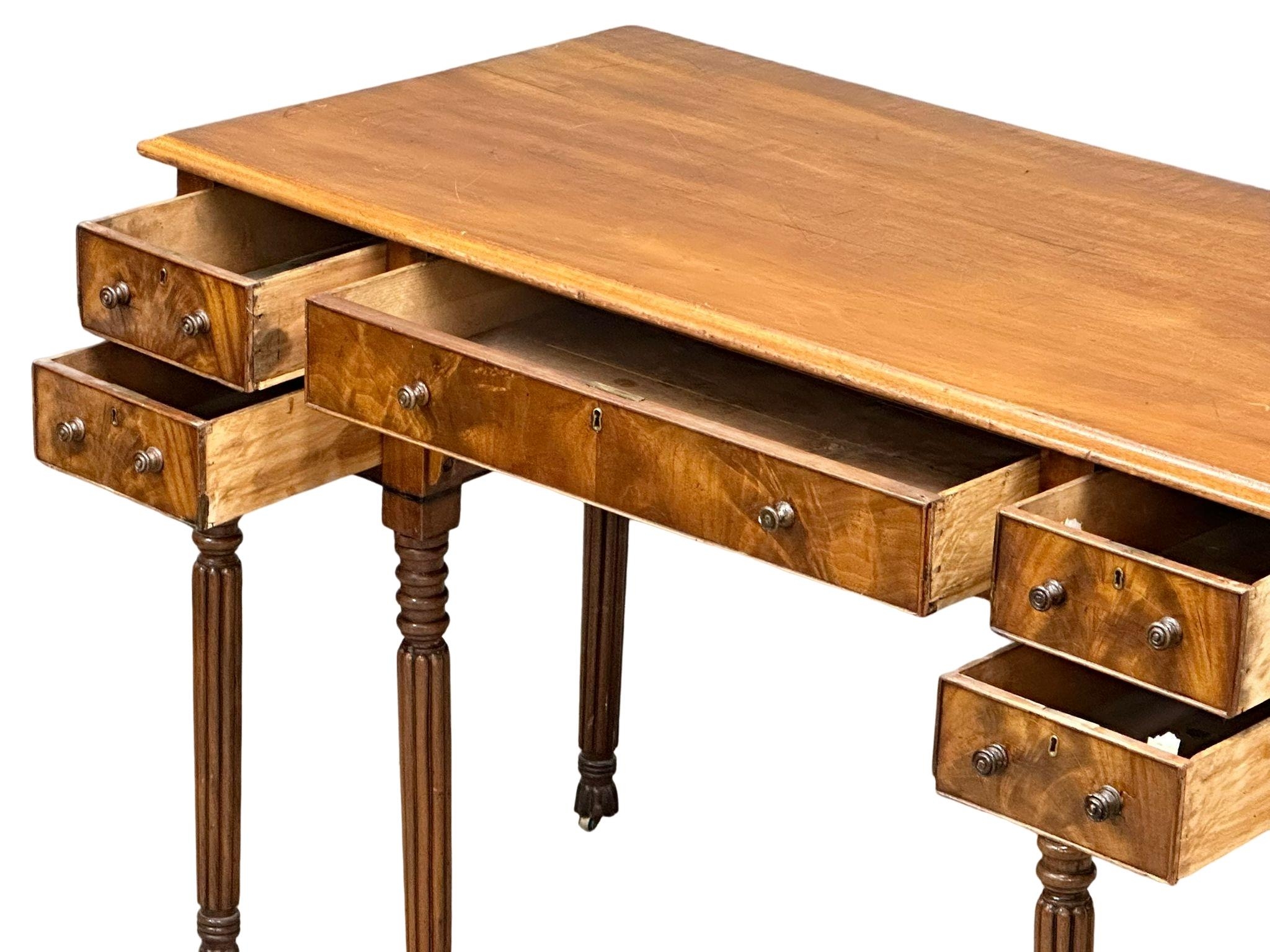A late George IV mahogany side table/desk on reeded legs. 126cm x 61cm x 80cm - Image 6 of 9