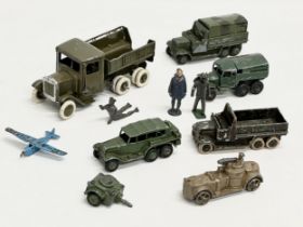 A collection of vintage Britains and Dinky military vehicles and figures.