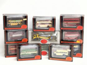 A collection of Exclusive First Edition model cars, buses and trucks.