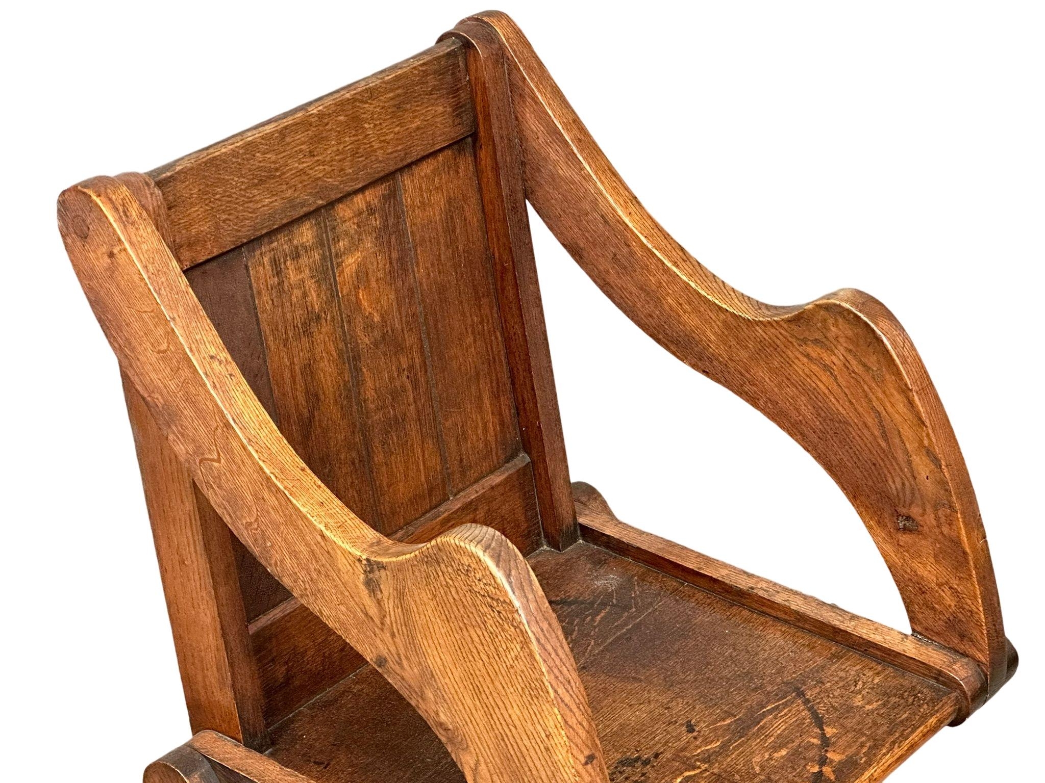 A late 19th century Glastonbury oak armchair. Circa 1890-1900. - Image 5 of 5