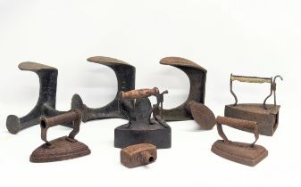 A quantity of 19th century shoe lasts and smoothing irons.