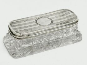 A late 19th/early 20th century silver and cut glass vanity jar. Rubbed makers name. 9.5x4.5x3cm