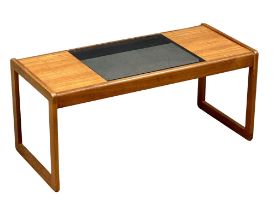 A Mid Century teak coffee table with smoked glass top by Myer. 96x43x43cm