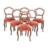 A set of 6 Victorian Walnut Balloon Back dining chairs on Cabriole legs. Circa 1860-1870.