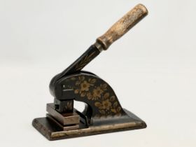 A Mid Victorian cast iron stamp press/paper embosser. 17x19cm