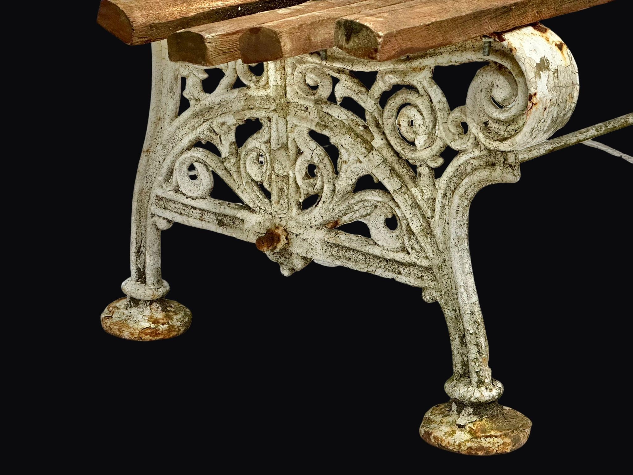 A Victorian cast iron garden bench with later teak straps. Circa 1860. 152cm - Image 2 of 3