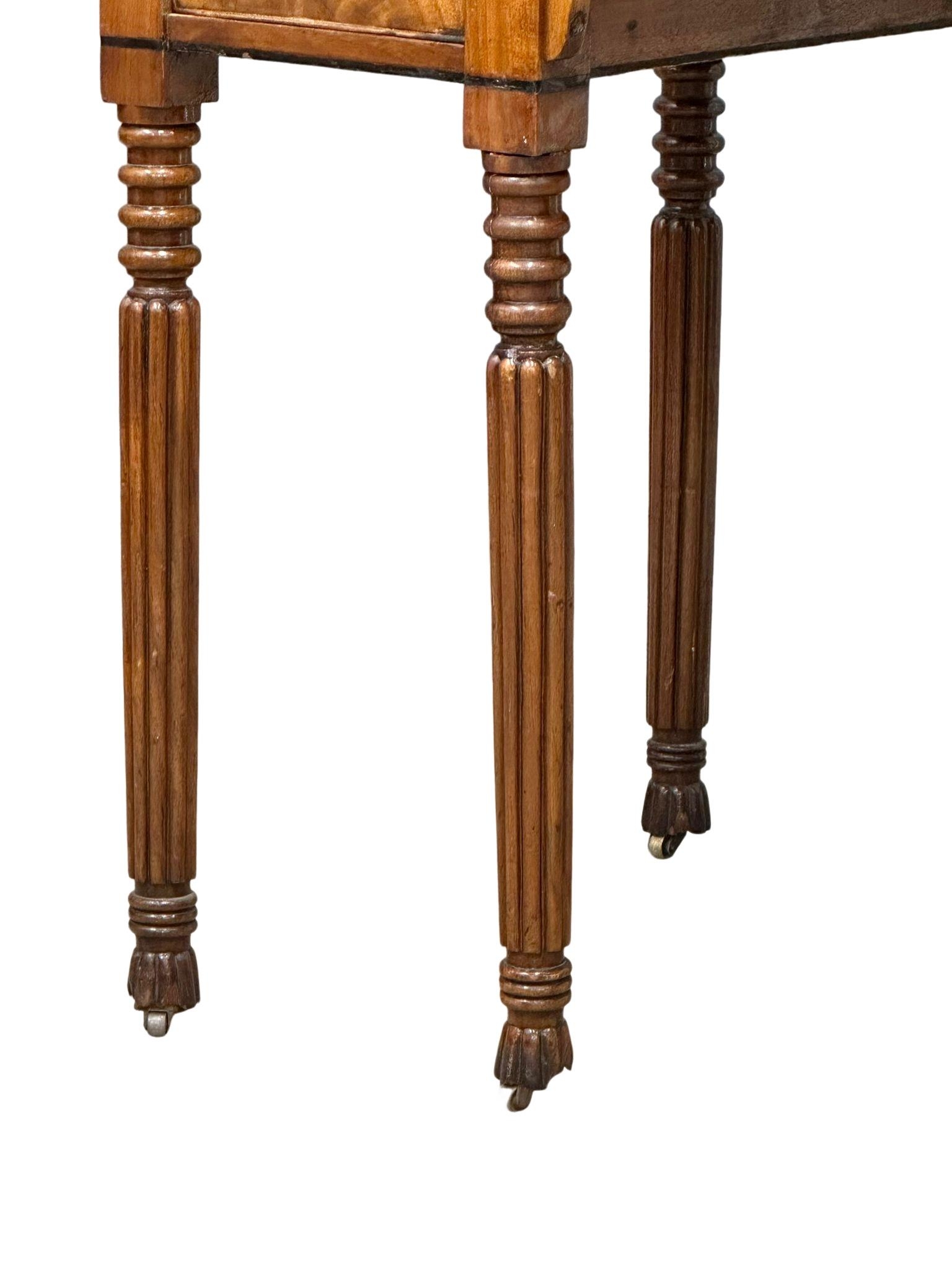 A late George IV mahogany side table/desk on reeded legs. 126cm x 61cm x 80cm - Image 5 of 9