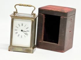 A late 19th century brass carriage clock with case.