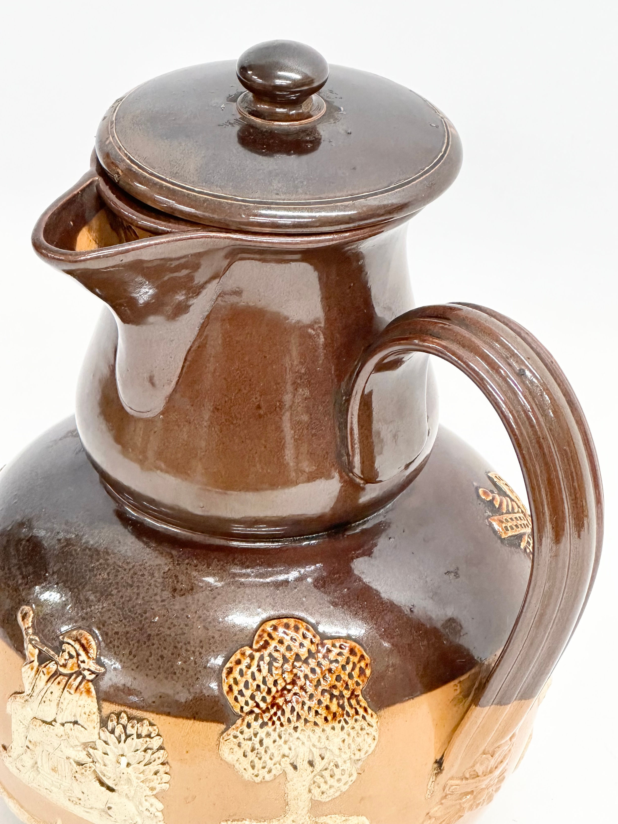 A Royal Doulton Lambeth ‘Harvest’ flagon with spout and sieve. Early 20th century. 17x15x25cm - Image 2 of 7