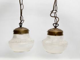 A pair of mid 20th century light fittings. 57cm with chain