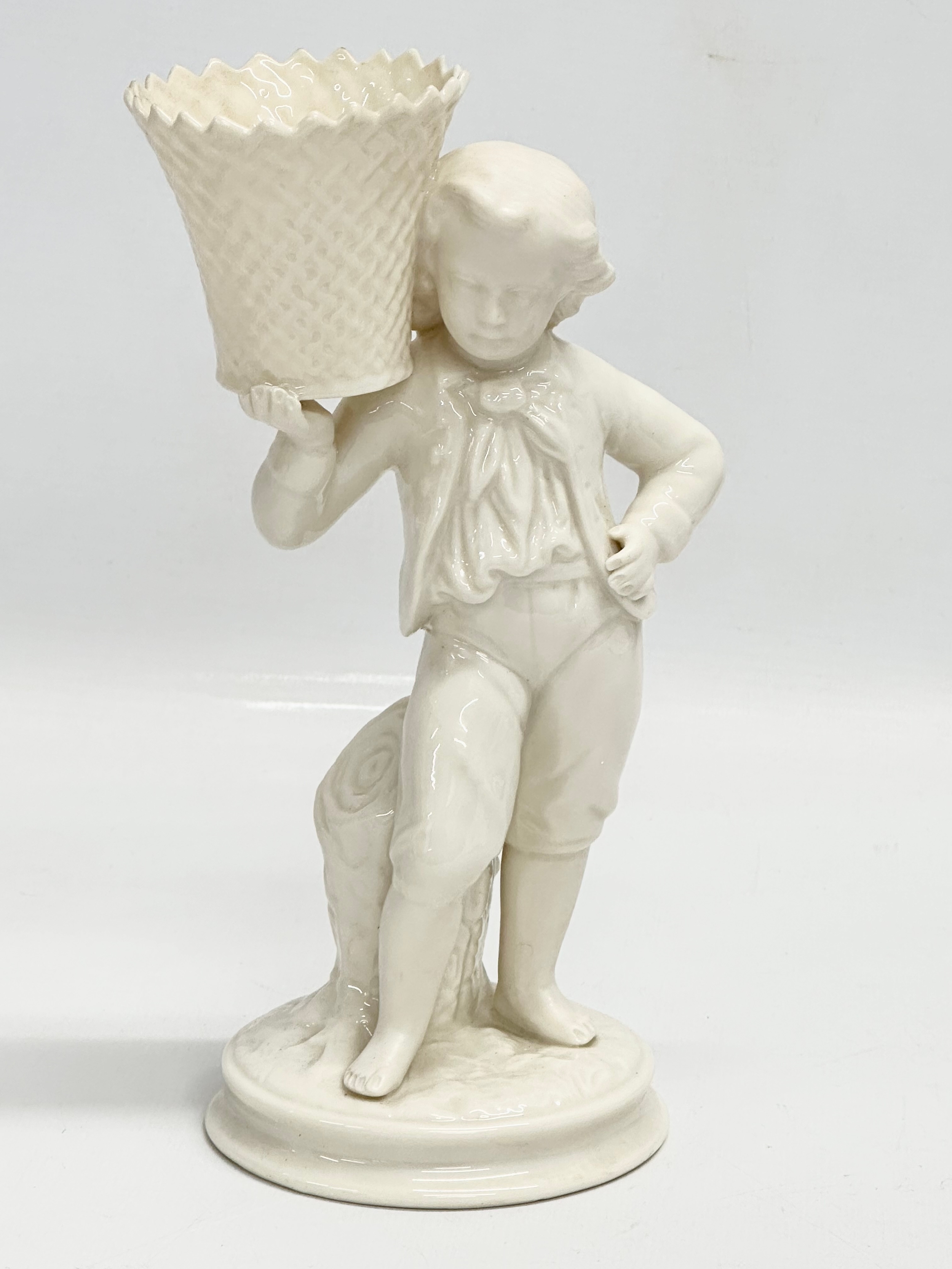 A pair of Belleek Pottery ‘Basket Carrier’ figurines. Girl basket Bearer, Boy Basket Bearer. 21.5cm - Image 2 of 5