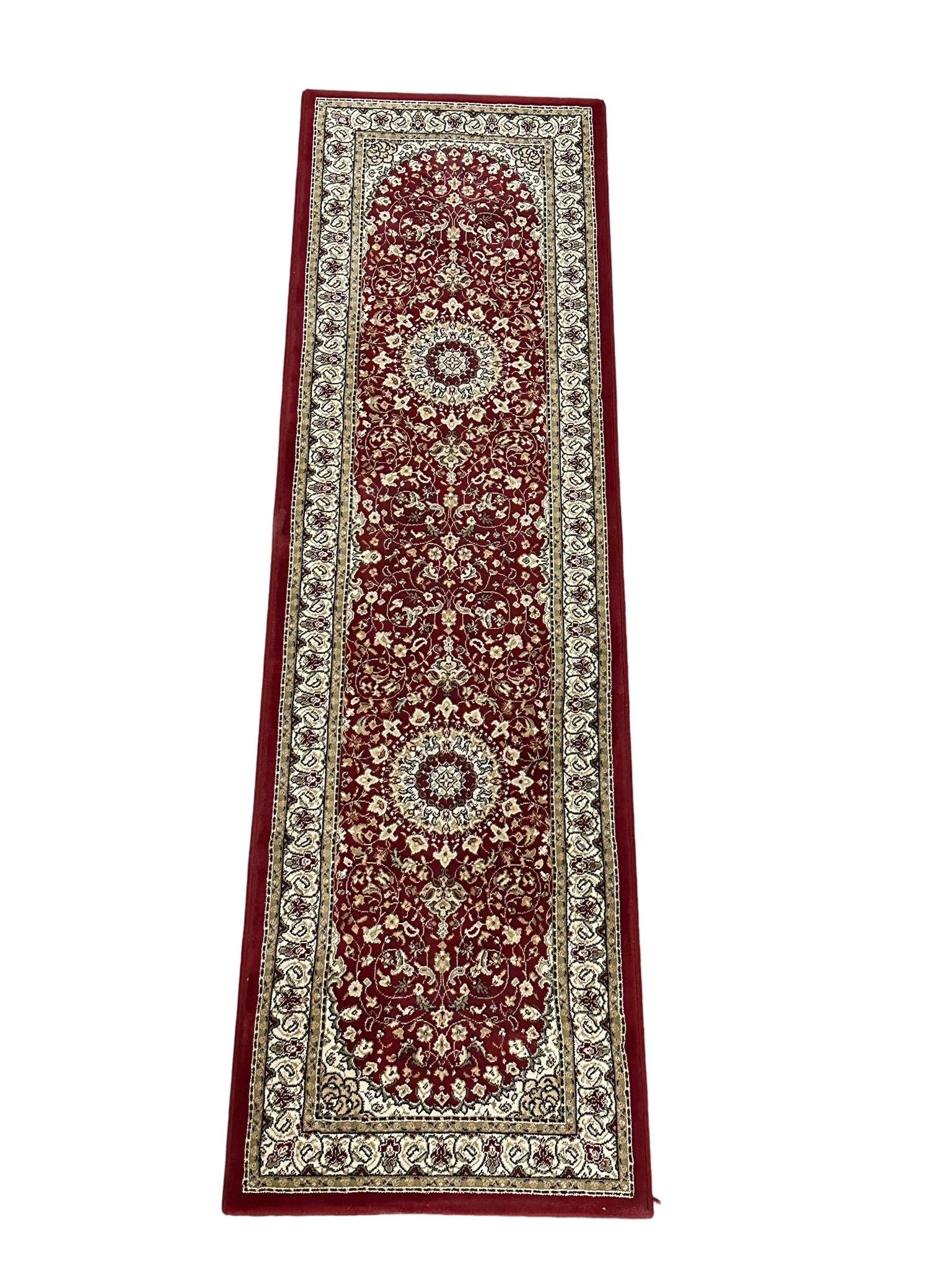 A Middle Eastern style runner rug. 66x230cm