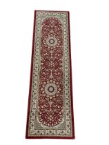 A Middle Eastern style runner rug. 66x230cm